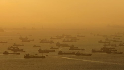 File photo of shipping vessels and oil tankers lining up on the eastern coast of Singapore